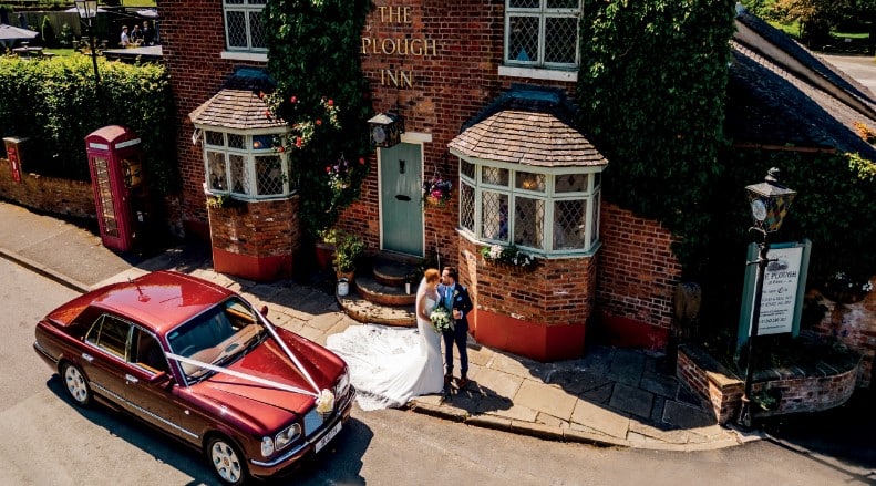 A classic wedding car outside The Plough Inn